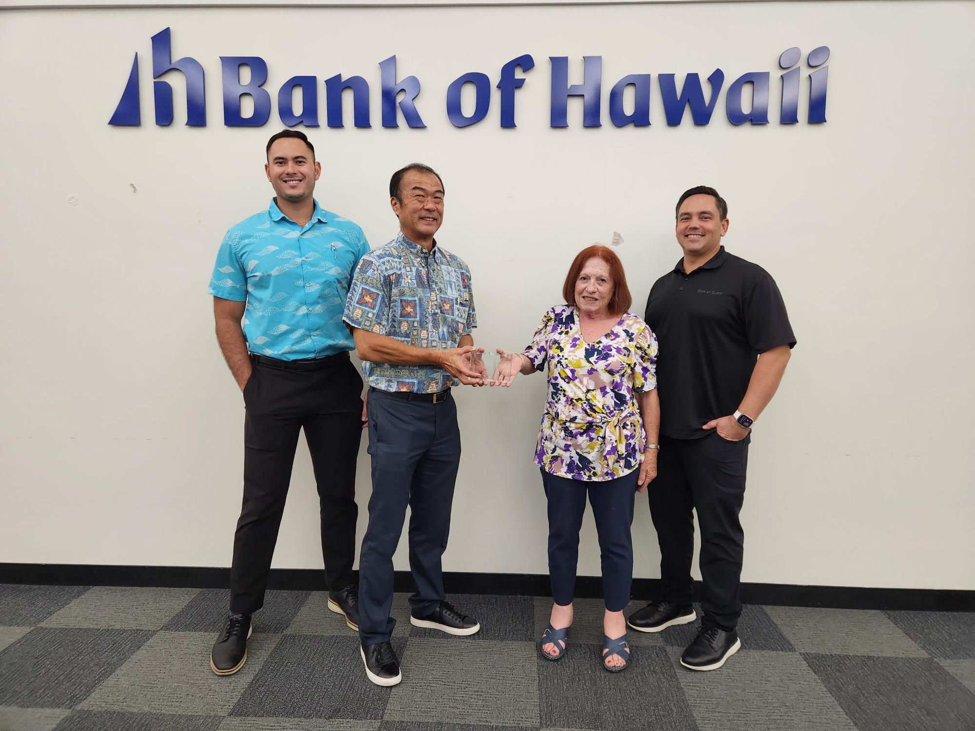 (From left) Michael S. Sakazaki, senior vice president/senior market manager; Mark H. Tokito, senior vice president, West Pacific Commercial Banking, both with Bank of Hawaii; Maratita; and Cook.