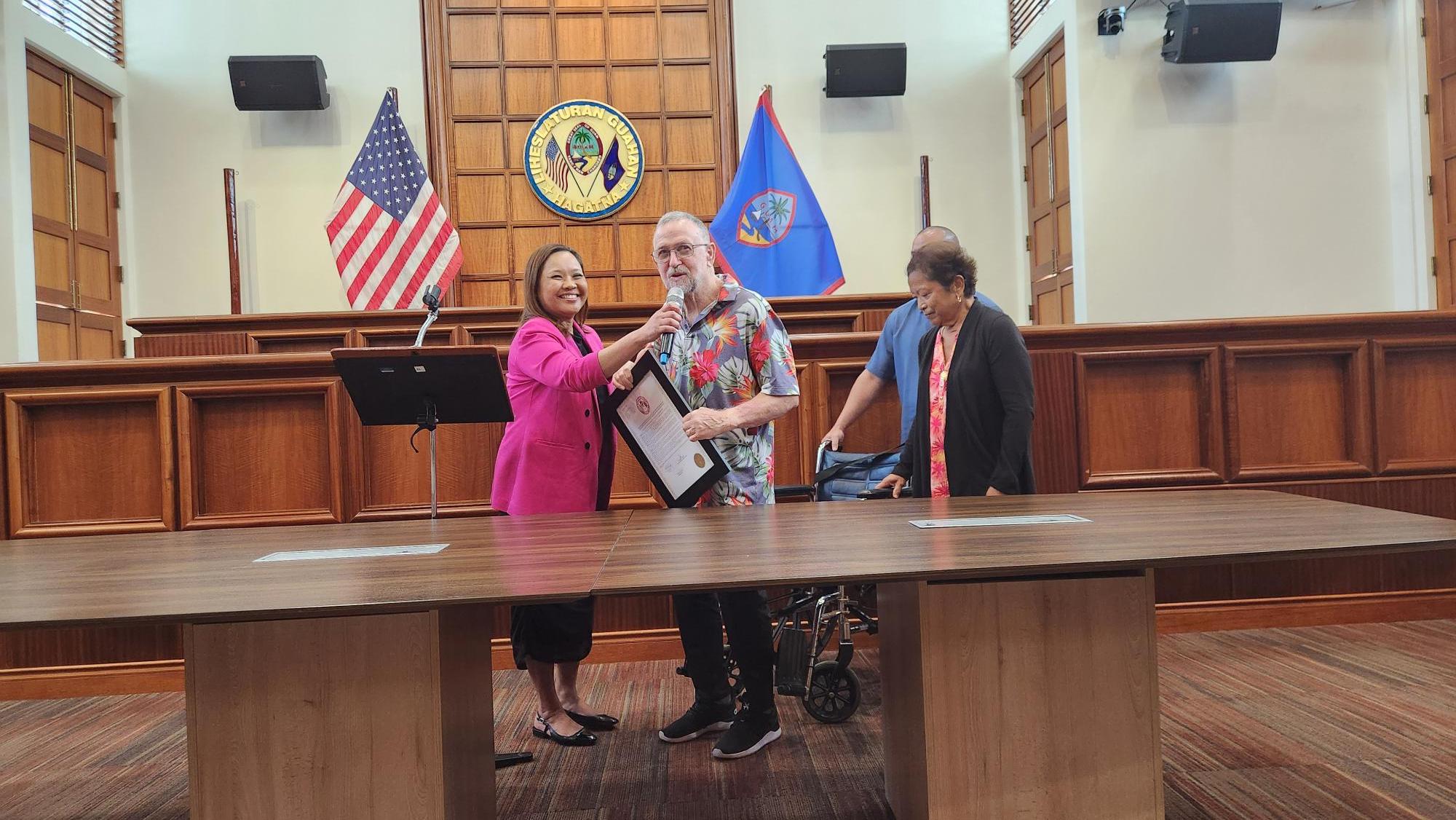Frank J. Whitman, on Sept. 2, was presented with a Guam Legislative resolution at the Guam Congress Building by Sen. Sabrina Salas on his “dedicated career as a teacher for the Guam Department of Education and as a professional journalist; and congratulating him on the occasion of his retirement.” Photo by Maureen N. Maratita