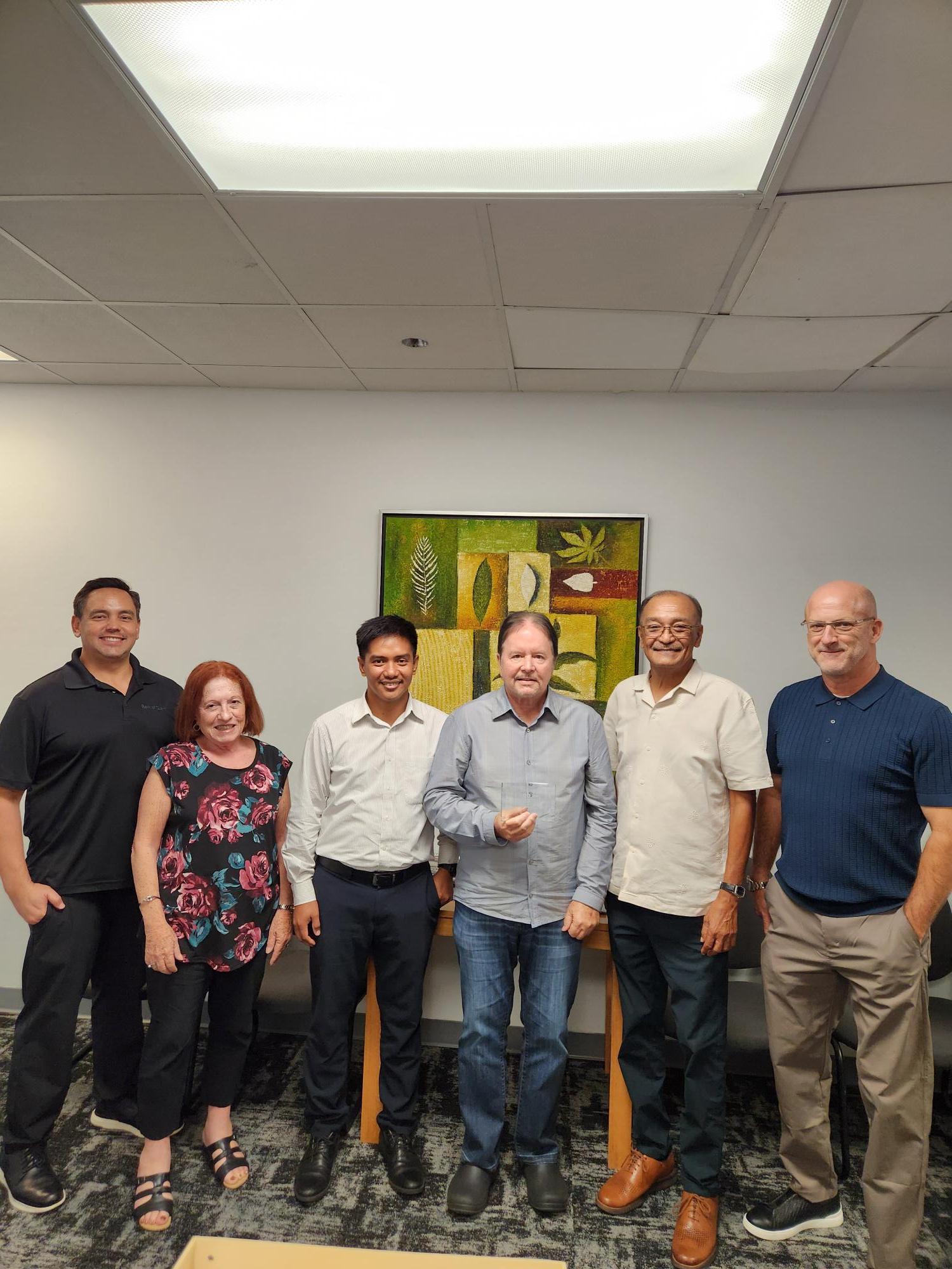 (From left) Cook; Edward G. Untalan, executive vice president and Guam-CNMI region manager of First Hawaiian Bank, Maratita; and John.