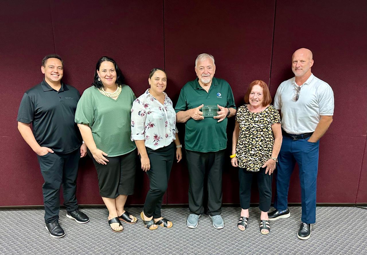 (From left) Cook; Michelle Kramer, managing director and Melissa Kramer, procurement manager, and Joseph “Jerry” Kramer, president and CEO, all with Pacific International (Guam) Inc.; Maratita, and John.