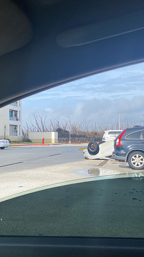 A vehicle was upended in Summer Towers in Tamuning after the typhoon. Photo by Khyomara Santana